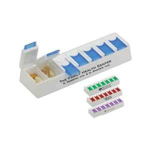   Flip   Pill sorter with 7 compartments marked with days of the week