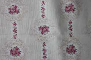 This is a beautiful beige stripe and rose design on a light cream 