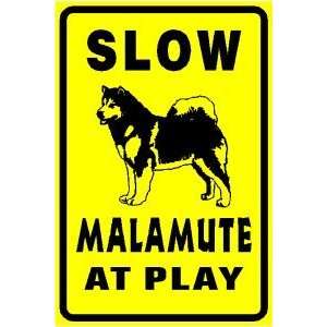    ALASKAN MALAMUTE AT PLAY slow warn dog sign