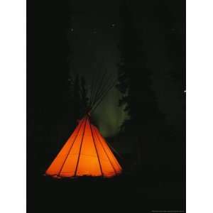  The Glow from a Campfire Makes a Shadow on a Tepee 