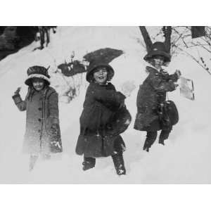  Three Girls in Winter Coats, Playing in the Snow 