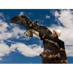  Eagle Hunter with Golden Eagle (Aquila Chrysaetos) on His 