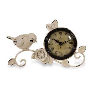   distressed finish clock has bird and leaf accents with roman numerals