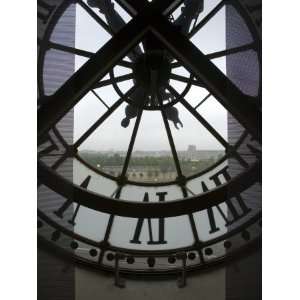  View Across Seine River Through Transparent Face of Clock 
