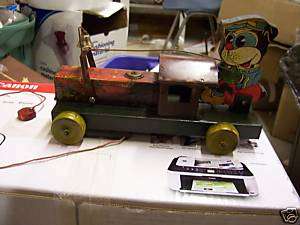 VINTAGE TIN TRAIN PULL TOY WITH KIRT THE ENGINEER  