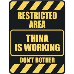   RESTRICTED AREA THINA IS WORKING  PARKING SIGN