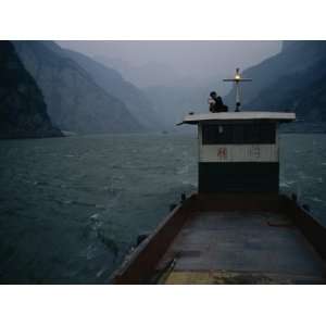  Man Changes a Lightbulb on a Barge near the Three Gorges 