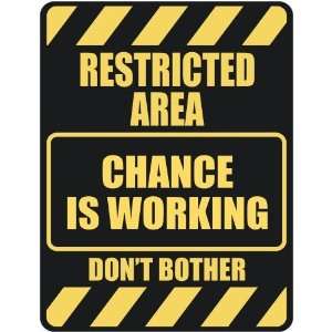   RESTRICTED AREA CHANCE IS WORKING  PARKING SIGN