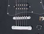 Twin open coil humbuckers and the industry standard Tune O Matic 