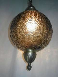   smoke glass ball shade with crackle texture glass is colored and not