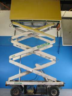   industries Aerial scissor lift 750lb cap. Max lift height 15ft  