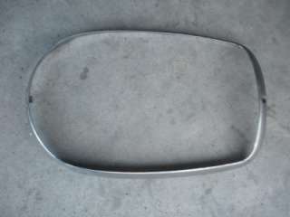 In this listing is an ORIGINAL oval, chrome headlight bezel for right 