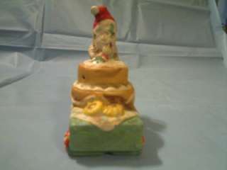 CERAMIC SANTA OR GNOME ON CAKE CART FIGURINE  