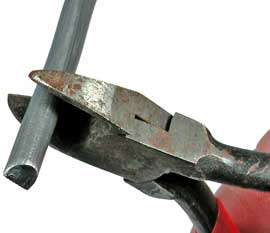 Cut the weight with a diagonal pliers or wire cutter at slightly 