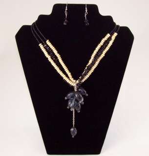 These fashion necklace and earring sets are made of acrylic and wood.