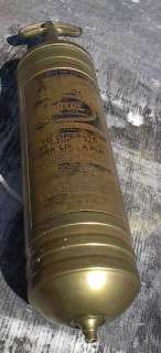 This is a vintage Pyrene fire extinguisher that measures 14 long. In 