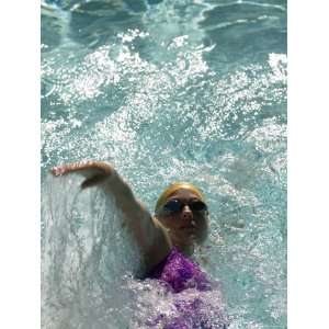  Young Woman Swimming the Backstroke in a Swimming Pool 